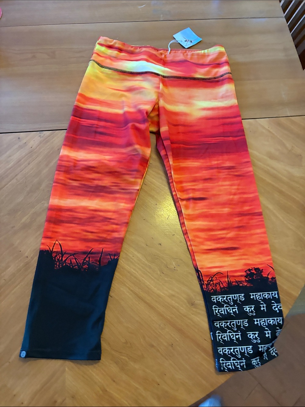 Onzie Sanskrit sunset Gradient capris in Orange and Black